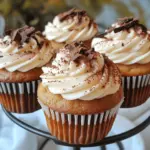 To make Tiramisu Cupcakes, gather these key ingredients: - 1 cup all-purpose flour - 1 teaspoon baking powder - 1/2 teaspoon baking soda - 1/4 teaspoon salt - 1/2 cup unsalted butter, softened - 1 cup granulated sugar - 2 large eggs - 1 teaspoon vanilla extract - 1/2 cup brewed coffee, cooled - 1/4 cup milk - 1 cup mascarpone cheese - 1 cup heavy cream - 1/4 cup powdered sugar - Unsweetened cocoa powder for dusting - Dark chocolate shavings for garnish (optional) These ingredients create a rich flavor and a soft texture. Each item plays a role in making these cupcakes truly special. If you need alternatives, here are some easy swaps: - Use almond flour for a gluten-free option instead of all-purpose flour. - Substitute coconut oil for butter if you want a dairy-free treat. - You can replace mascarpone cheese with cream cheese for a different flavor. These substitutions can help fit dietary needs without losing the cupcake's essence. Accurate measurements are key to great baking. Here are some tips: - Use a kitchen scale for precise amounts, especially for flour. - Spoon flour into your measuring cup and level it off with a knife; don't scoop it directly. - Always use room temperature eggs and butter for a smoother batter. Following these tips will help you achieve the best results. For the complete recipe, be sure to check the Full Recipe section. Start by preheating your oven to 350°F (175°C). Line a cupcake pan with cupcake liners. In a bowl, whisk together 1 cup of all-purpose flour, 1 teaspoon baking powder, 1/2 teaspoon baking soda, and 1/4 teaspoon salt. This mix will help your cupcakes rise perfectly. In a large bowl, cream 1/2 cup of softened unsalted butter with 1 cup of granulated sugar until it’s light and fluffy. This usually takes about 3-4 minutes. Next, beat in 2 large eggs one at a time. Then add in 1 teaspoon of vanilla extract. Now, mix 1/2 cup of cooled brewed coffee with 1/4 cup of milk in a separate bowl. Gradually add the dry mix and the coffee mixture to the butter mix, starting and ending with the dry ingredients. Stir gently until just combined. Now, divide your batter evenly into the lined cupcake pan. Fill each liner about 2/3 full. Place the pan in the preheated oven and bake for 18-20 minutes. To check if they’re done, insert a toothpick in the center. If it comes out clean, they are ready! Let the cupcakes cool in the pan for 5 minutes before moving them to a wire rack to cool completely. This cooling step is key; it helps the texture stay just right. While your cupcakes cool, let’s make the frosting. In a mixing bowl, beat together 1 cup of mascarpone cheese and 1 cup of heavy cream. Keep mixing until you see soft peaks form. Gradually add in 1/4 cup of powdered sugar while continuing to beat the mixture. You want to beat until stiff peaks form. This will give you a rich, creamy frosting. Once your cupcakes are completely cool, use a piping bag or a knife to spread or pipe the mascarpone frosting on top of each cupcake. For a finishing touch, dust them with unsweetened cocoa powder and add optional dark chocolate shavings for decorating. Enjoy your deliciously decadent tiramisu cupcakes! For the complete recipe, check out the Full Recipe section. When making tiramisu cupcakes, avoid overmixing the batter. Overmixing can lead to tough cupcakes. Also, be sure to let your coffee cool before mixing it in. Hot coffee can melt the butter in your batter and change its texture. Don’t forget to check the baking time. Every oven is different, so keep an eye on your cupcakes. Use a toothpick to test for doneness. For the best frosting, use chilled mascarpone and heavy cream. Cold ingredients whip up better. Beat the mascarpone first, then add the cream. This helps create a smooth texture. Don’t add powdered sugar too fast; do it slowly for better results. Want to enhance the flavor? Try adding a splash of coffee liqueur to the frosting for an extra kick. You can also fold in a bit of cocoa powder for a richer chocolate taste. Another idea is to use different extracts, like almond or hazelnut, to give your cupcakes a unique twist. For a complete guide, check out the Full Recipe for detailed steps and tips. {{image_2}} You can add a twist to classic tiramisu by making chocolate tiramisu cupcakes. Start with the same base recipe, but add cocoa powder to your dry mix. Use dark chocolate in your frosting for a rich, deep flavor. You can even fold in chocolate chips into the batter for extra decadence. These cupcakes keep the coffee flavor but add a delightful chocolate kick. To create vegan tiramisu cupcakes, swap out the dairy ingredients. Use a plant-based butter and replace eggs with flaxseed meal mixed with water. For the frosting, try using coconut cream instead of mascarpone cheese. Make sure to use vegan coffee and chocolate. These changes keep the essence of tiramisu while making it friendly for vegan diets. For gluten-free tiramisu cupcakes, substitute all-purpose flour with a gluten-free blend. Ensure that your baking powder is gluten-free as well. The rest of the recipe can remain the same. This allows you to enjoy the rich flavors of tiramisu without worrying about gluten. These cupcakes still taste amazing and look beautiful. You can find the full recipe above to try these variations. Store leftover tiramisu cupcakes in an airtight container. Keep them in the fridge. They stay fresh for up to three days. If you want to keep them longer, freezing is a great option. Just make sure they cool completely first. To freeze these delicious cupcakes, wrap each one tightly in plastic wrap. Place them in a freezer-safe bag or container. They can last up to three months in the freezer. When you're ready to enjoy, just take them out and let them thaw in the fridge. Reheating tiramisu cupcakes is simple. If they are cold from the fridge, you can warm them in the microwave. Heat for about 10-15 seconds. Make sure not to overheat them. You want them warm, not hot. If they are frozen, let them thaw first before reheating. Enjoy your tasty treat! For the full recipe, check out the details above. If you don’t have mascarpone cheese, you can use cream cheese. Just soften it first. Mix it with a little heavy cream to mimic the rich texture. Ricotta cheese is another option, but blend it well to smooth it out. Each choice will change the taste a bit, but they still work great in these cupcakes. Yes, you can make these cupcakes ahead of time! Bake them and let them cool completely. Store them in an airtight container for up to two days. You can frost them right before serving. This keeps the frosting fresh and the cupcakes moist. To cut down on sweetness, reduce the sugar in the batter. You can use about 3/4 cup instead of a full cup. For the frosting, use less powdered sugar. You can also add a pinch of salt to balance the flavors. This will help create a more balanced taste without losing the fun of a dessert. This post covered everything you need for delicious tiramisu cupcakes. We discussed essential ingredients and smart substitutes. You learned step-by-step how to prep, bake, and frost your cupcakes. I shared tips to avoid common mistakes and enhance flavor. Plus, we explored fun variations like vegan and gluten-free options. Finally, you found out how to store leftovers and reheat them. Trying these cupcakes will impress friends and family. Enjoy baking and experimenting with tasty twists!
